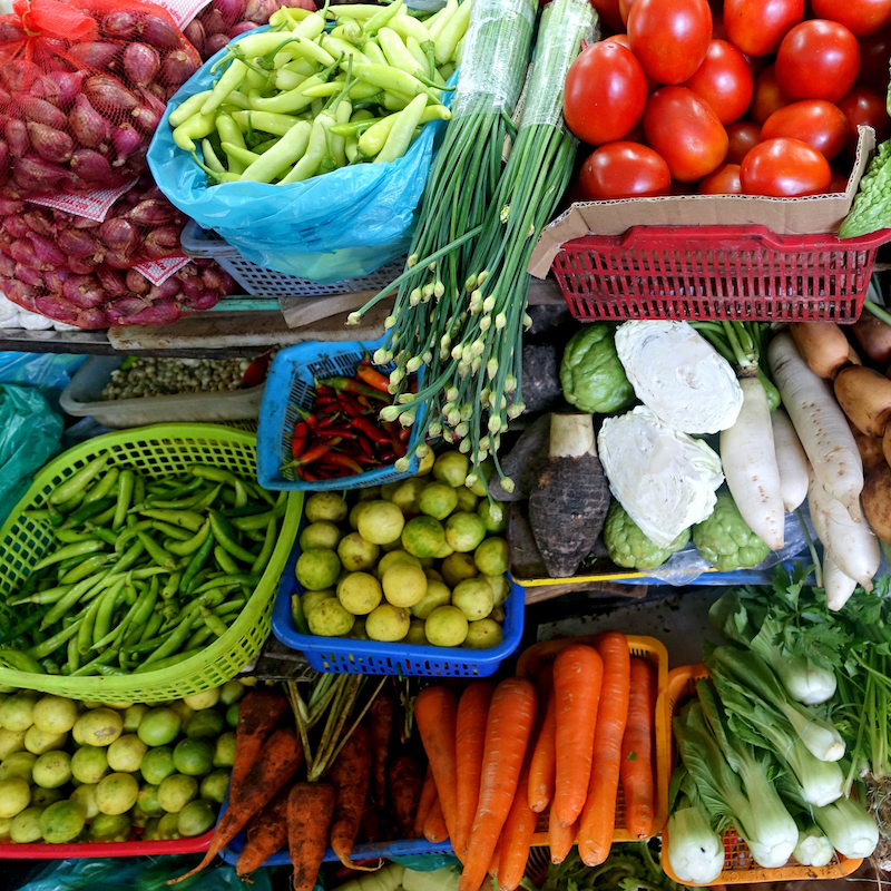 an assortment of vegetables in baskets